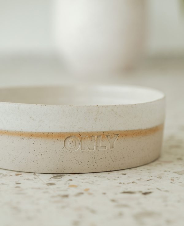 White ceramic bowl with the word "Only" written in cursive script on the front.