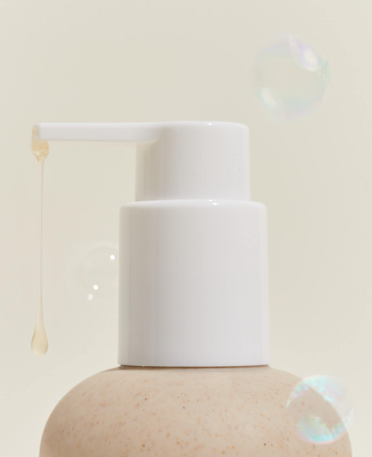 A soap bottle surrounded by soap bubbles, creating a playful and refreshing image.